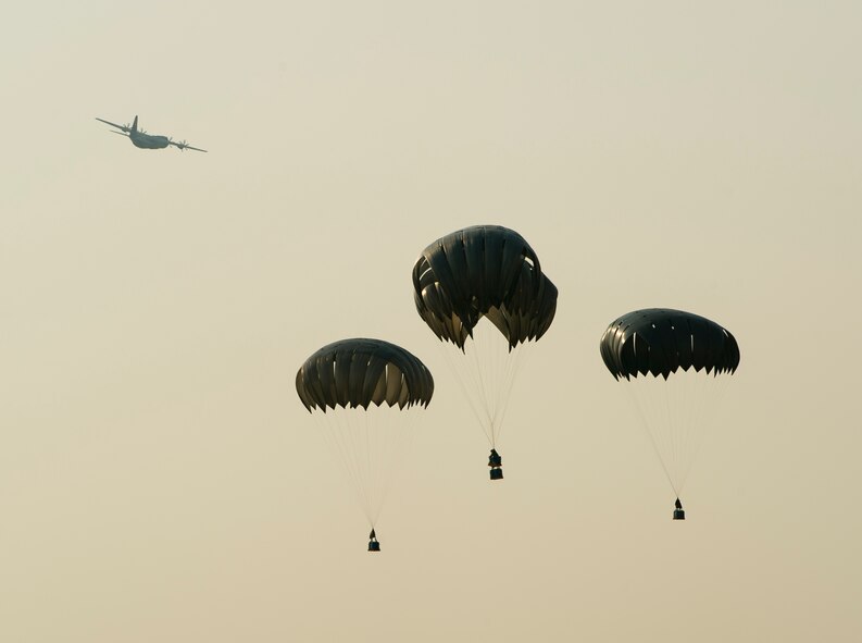 A U.S. Air Force C-130 Hercules performs multiple airdrops during Exercise Mobility Guardian at Yakima Training Center, Wash., Aug. 3, 2017. More than 3,000 Airmen, Soldiers, Sailors, Marines and international partners converged on the state of Washington in support of Mobility Guardian. The exercise is intended to test the abilities of the Mobility Air Forces to execute rapid global mobility missions in dynamic, contested environments. Mobility Guardian is Air Mobility Command's premier exercise, providing an opportunity for the Mobility Air Forces to train with joint and international partners in airlift, air refueling, aeromedical evacuation and mobility support. The exercise is designed to sharpen AirmenÕs skills in support of combatant commander requirements. (U.S. Air Force photo by Senior Airman Christopher Dyer)