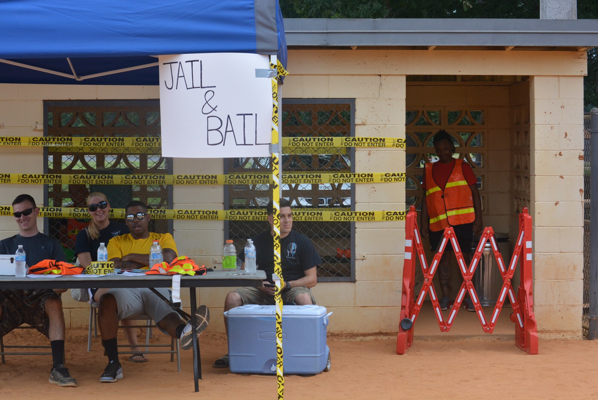 A few Airmen from the 14th Security Forces Squadron pretend to guard a makeshift jail as part of an event for the End of Summer Bash Aug. 4, 2017, on Columbus Air Force Base, Mississippi. 
The Jail and Bail event allowed people to pay for security forces members to take anyone from the base and lock them up for several minutes or even hours at a time. (U.S. Air Force photo by Master Sgt. Amanda Savannah)