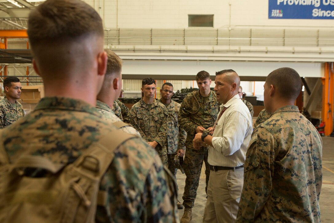 Marines tour the depot-level maintenance facility at Marine Corps Support Facility Blount Island, Fla., Aug. 10, 2017.