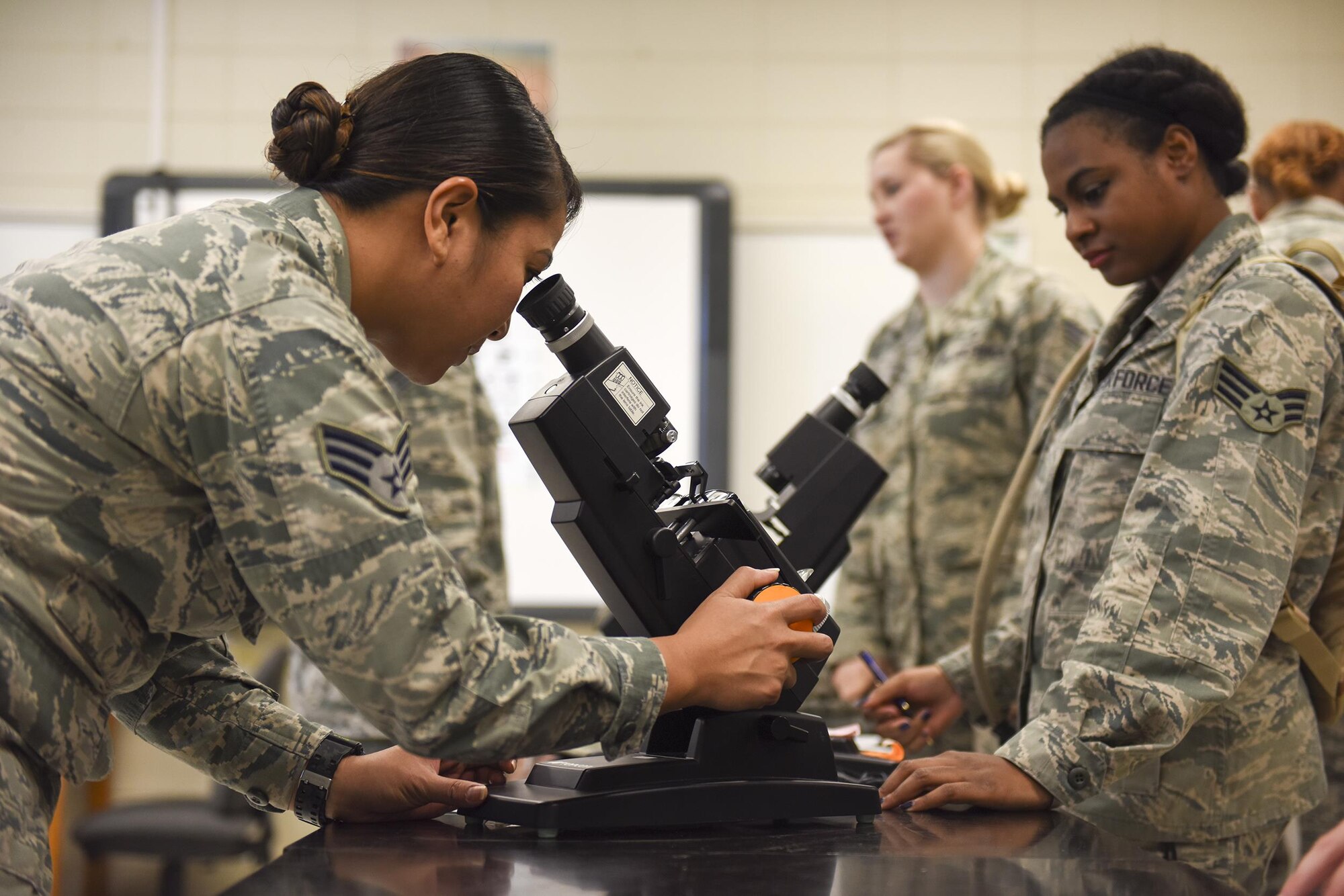 Air Force Senior Airman Maria Romulo, an optometry technician with the 624th Aerospace Medicine Flight, Andersen Air Force Base, Air Force Reserve, Guam, sets up a lensometer to measure the prescription in eye glasses during Smoky Mountain Medical Innovative Readiness Training in Hayesville, N.C., Aug. 1, 2017. The IRT program meets training requirements for active, reserve and National Guard members and units while addressing public and society needs.