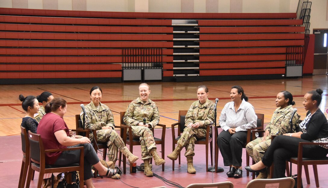 Far East District commander Col. Teresa Schlosser (center), and FED employees Jisun Kang (2nd from left), Emam Sundquist (3rd from right),  Mia Dukuly (right) sit amongst participants of the 2017 Women's Equality Day panel discussion held at Sitman Fitness Center, Camp Humphreys, South Korea, Aug. 10, 2017.