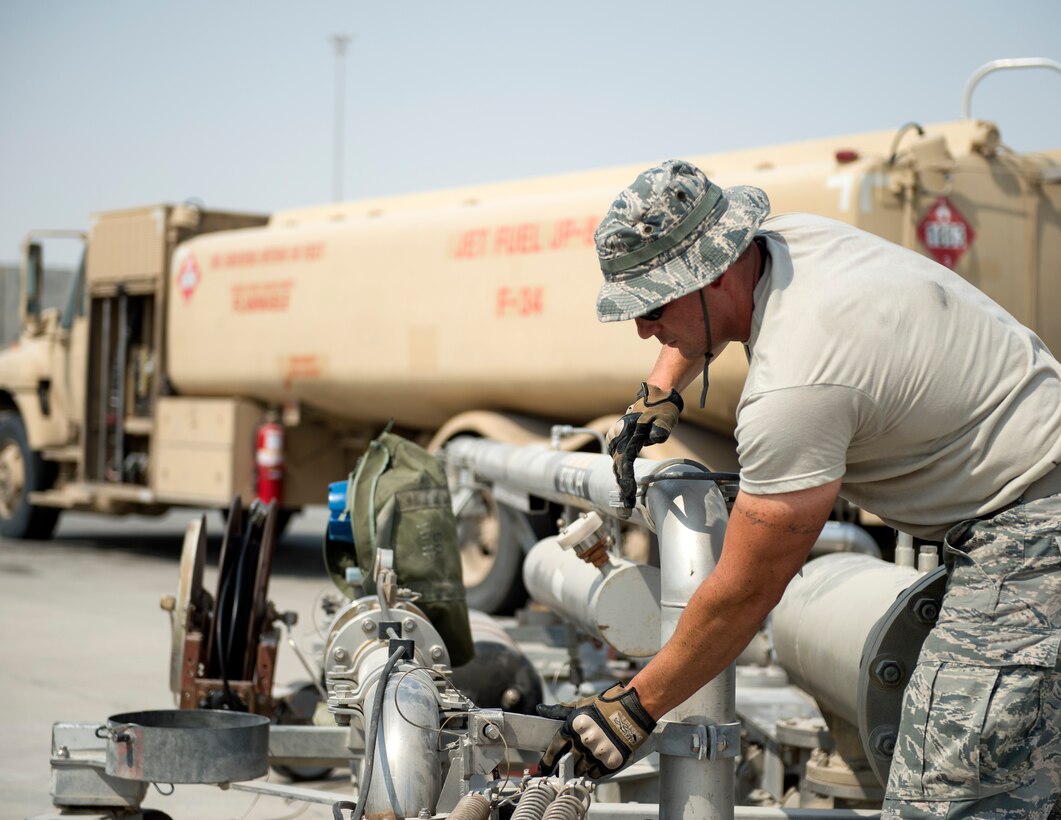 U.S Air Force Tech. Sgt. Mathew Kaski, dayshift supervisor with the 379th Expeditionary Logistics Readiness Squadron, Fuels Management Flight, completes refueling his truck at Al Udeid Air Base, Qatar, July 24, 2017.