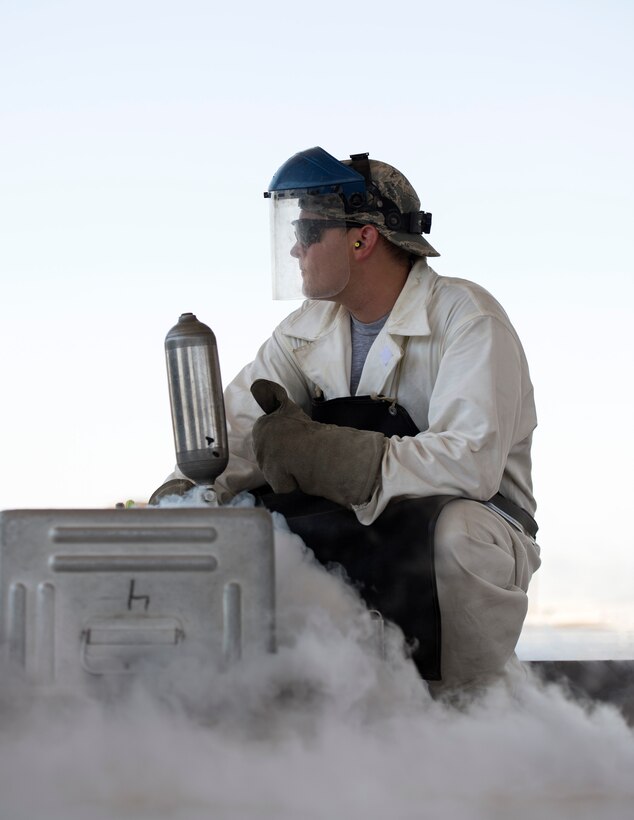 U.S. Air Force Senior Airman Samuel Fallot,a  cryogenics journeyman with the 379th Expeditionary Logistics Readiness Squadron, Fuels Management Flight, gives a thumbs up at Al Udeid Air Base, Qatar, Aug. 9, 2017.
