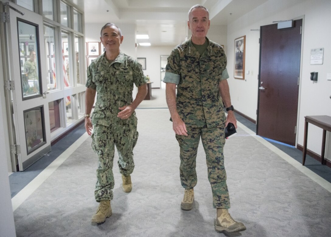 Marine Corps Gen. Joe Dunford, chairman of the Joint Chiefs of Staff, right, meets with Navy Adm. Harry B. Harris Jr., commander of U.S. Pacific Command, at Joint Base Pearl Harbor-Hickam, Aug. 11, 2017. Dunford stopped by the command prior to departing for Korea, China and Japan. DoD photo by Navy Petty Officer 1st Class Dominique A. Pineiro