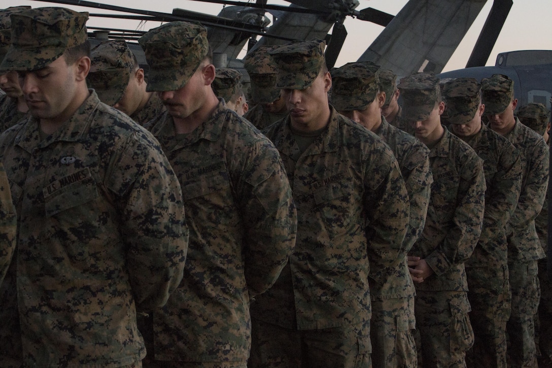 The Marines and Sailors of the 31st Marine Expeditionary Unit and USS Bonhomme Richard (LHD 6) Expeditionary Strike Group joined together to honor and remember 1st Lt. Benjamin Cross, Cpl. Nathaniel Ordway and Pfc. Ruben Velasco during a moving sunset memorial aboard the Bonhomme Richard, Aug. 9, 2017. Several speakers remembered Cross, Ordway and Velasco during the memorial, offering their fellow Marines an opportunity to recall shared moments, common aspirations and stories of the three who gave their last full measure of devotion. Honored by men and women of all ranks for their sacrifice, with a cool sea breeze scented with the memories of times shared, Benjamin, Nathaniel and Ruben are Marines who will never be forgotten. (U.S. Marine Corps photo by Lance Cpl. Amy Phan/Released)