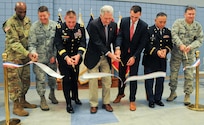 The U.S. Army Reserve’s 99th Regional Support Command hosted a ribbon-cutting ceremony Aug. 13 for the Staff Sgt. Jonah E. Kelley Army Reserve Center on Joint Base McGuire-Dix-Lakehurst, New Jersey. Cutting the ribbon are (from left): Col. James Martin, deputy commander of JBMDL and commander of U.S. Army Support Activity-Fort Dix; Col. Neil R. Richardson, commander of JBMDL and the 87th Air Base Wing; Maj. Gen. Troy D. Kok, commanding general of the 99th RSC; Bob Smyth, field representative for U.S. Congressman Tom MacArthur; Rich Everett, legislative assistant to U.S. Congressman Chris Smith; Col. Peter Tan, commander of the Army Reserve’s 7301st Medical Training Support Battalion and facility commander of the Kelley ARC; and Maj. Gen. Christopher J. Bence, commanding general of the U.S. Air Force Expeditionary Center.
