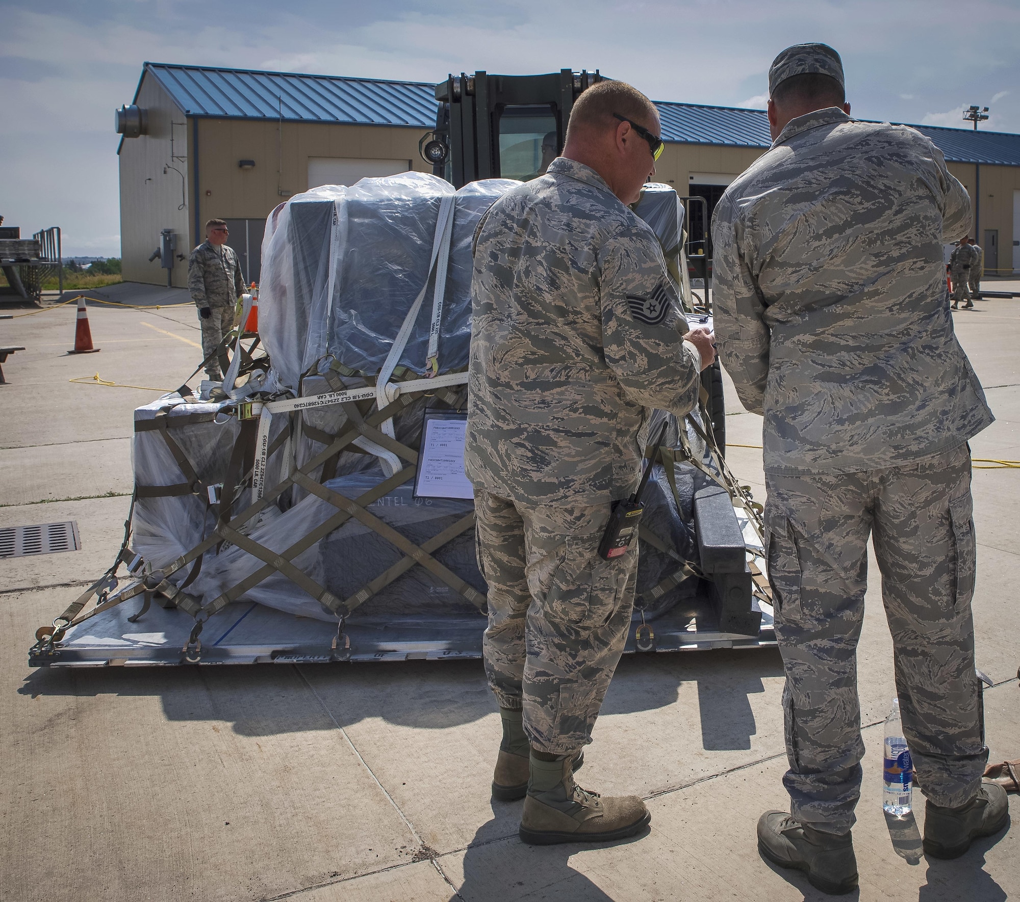 An air transportation supervisor checks an increment monitor into the drop-off area for the deployment exercise.