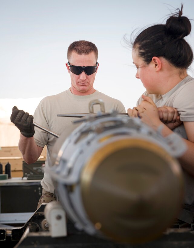 Airmen install a tail fuse.