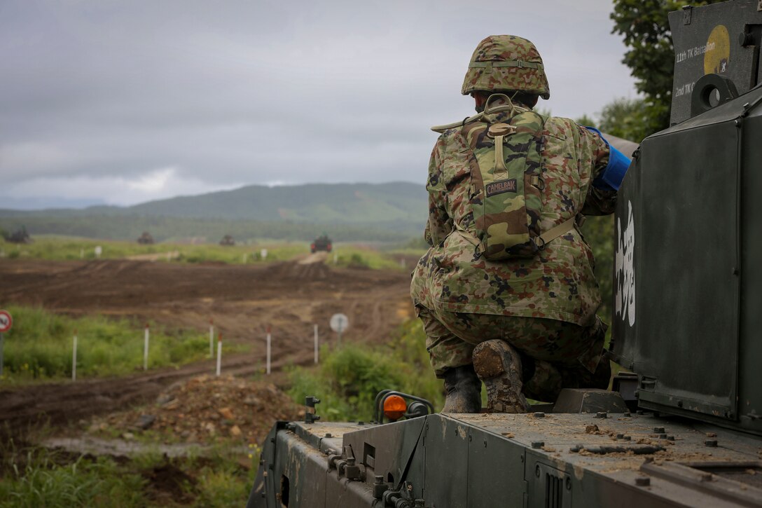Japan Ground-Self Defense Force Sgt. First Class Ryuta Hirano observes light armored vehicle live-fire Aug. 14, 2017, in Hokudaien, Japan, during Northern Viper. Hirano is looking forward to continue training with the U.S., he said. "Working with the U.S. is a great opportunity to learn their techniques and teach them ours." Hirano is attached to 11th Tank Battalion, 2nd Tank Company.