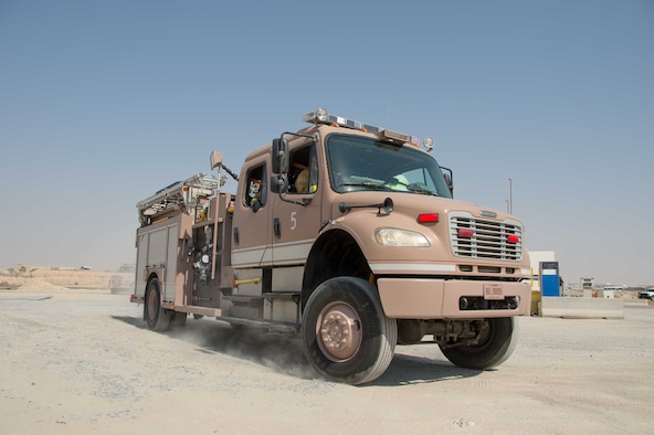 A 386th Air Expeditionary Wing fire truck comes to a stop at the scene of an incident during a training scenario Friday, August 11, 2017, at the PERSCO building at an undisclosed location in Southwest Asia. (U.S. Air Force photo by 1st Lt. Rashard Coaxum)