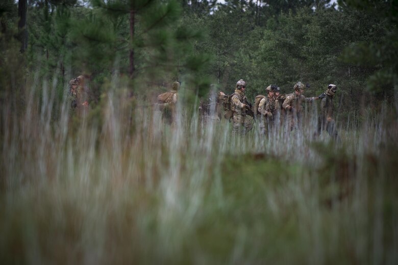 Pararescuemen from the 38th Rescue Squadron move a downed pilot during combat search and rescue training as part of Stealth Guardian, Aug. 10, 2017, in the Apalachicola National Forest, Fla.