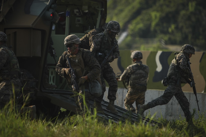 U.S. and South Korean Marines exit from a South Korean amphibious assault vehicle.
