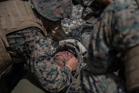 BRIDGEPORT, Calif. - U.S. Marine Pfc. Nelson Ramirez, a motor vehicle operator with Combat Logistics Battalion 5, Combat Logistics Regiment 1, 1st Marine Logistics Group, assumes the role of a casualty during a simulated casualty drill as part of Mountain Training Exercise 4-17 at Mountain Warfare Training Center, Aug. 2, 2017. A simulated casualty drill consists of triage, nine-line medical radio transmission, treating a casualty, and an evacuation plan. (U.S. Marine Corps photo by Lance Cpl. Timothy Shoemaker)