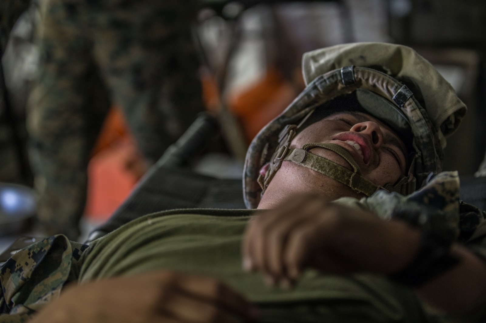 BRIDGEPORT, Calif. - U.S. Marine Pfc. Nelson Ramirez, a motor vehicle operator with Combat Logistics Battalion 5, Combat Logistics Regiment 1, 1st Marine Logistics Group, assumes the role of a casualty during a simulated casualty drill as part of Mountain Training Exercise 4-17 at Mountain Warfare Training Center, Aug. 2, 2017. The Mountain Warfare Training Center is 6800 feet above sea level and exists to train units in complex compartmented terrain. Simulated casualty drills provide Marines with the opportunity to operate in its unique terrain and overcome various environmental obstacles. (U.S. Marine Corps photo by Lance Cpl. Timothy Shoemaker)