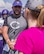 Shelly Becker presents the Clovis High School football team’s head coach, Calvin Fullerton, with a donation to help improvements to the school’s football program. Becker started a pay it forward campaign in her late husband’s honor to do nice things for Cannon Air Force Base and community members. (U.S. Air Force Photo by Staff Sgt. Charles Dickens/Released)