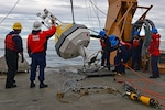 HEALY’s deck crew set a NOAA buoy in the Arctic Ocean in support of the 1701 science mission.