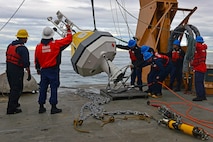 HEALY’s deck crew set a NOAA buoy in the Arctic Ocean in support of the 1701 science mission.