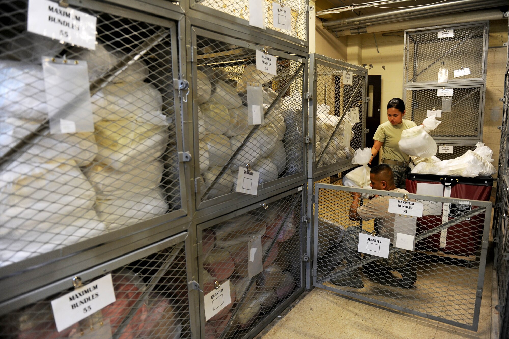 U.S. Air Force Staff Sgts. Joel Valencia and Rosita Francisco, both services craftsmen assigned to the 254th Force Support Squadron, Guam Air National Guard, sort and store linen in the contingency dormitories Aug. 9, 2017, during RED FLAG-Alaska (RF-A) 17-3, at Eielson Air Force Base, Alaska. Valencia and Francisco are part of a five-man team from the 254 FSS supporting RED FLAG-Alaska 17-3, the world’s premier tactical joint and coalition air combat employment exercise. (U.S. Air Force photo by Staff Sgt. Jerilyn Quintanilla)