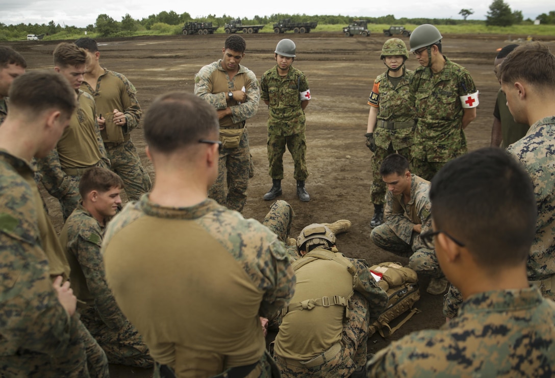 U.S. Marines and Japan Ground Self-Defense Force troops learn tactical combat casualty care