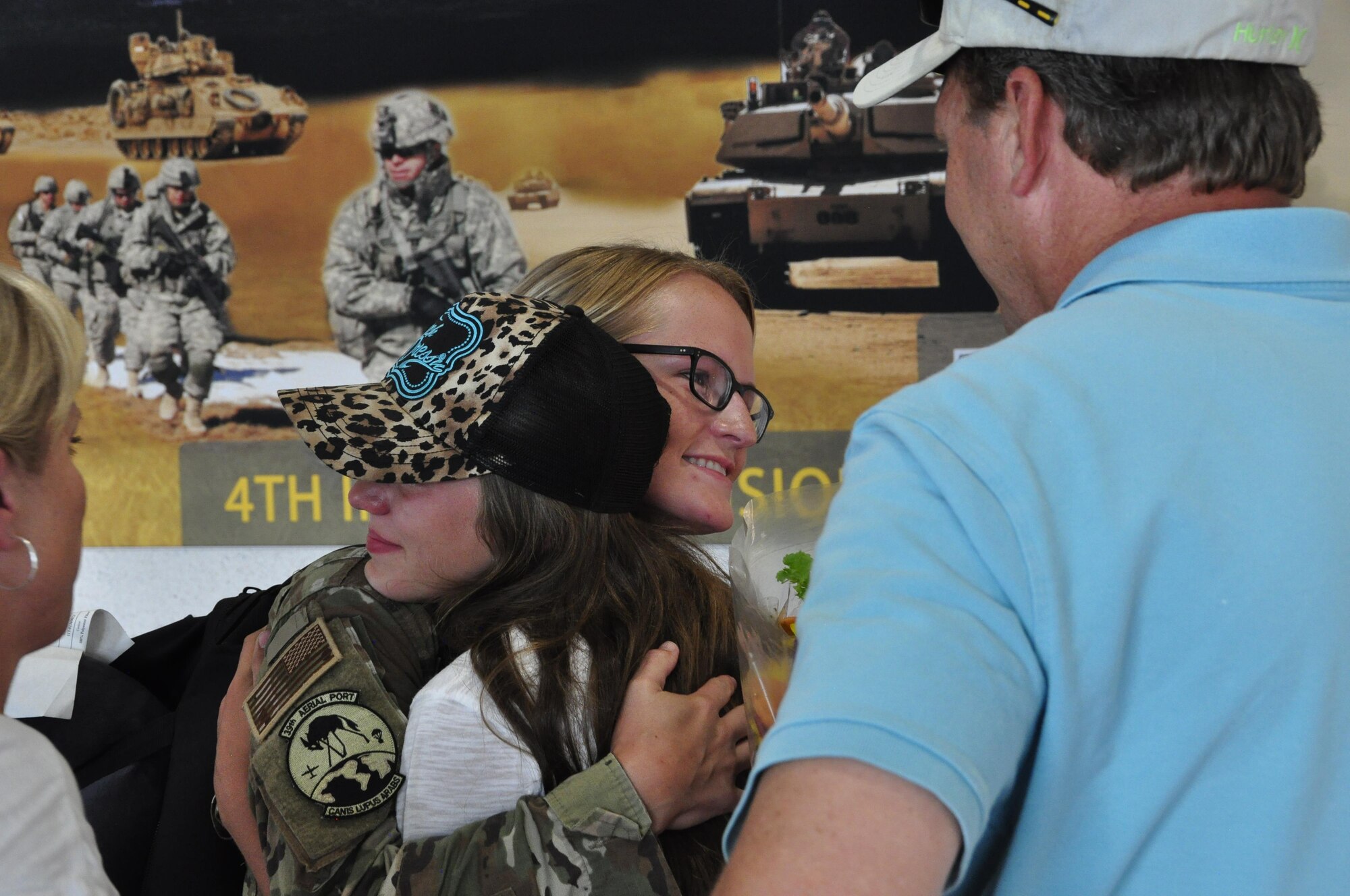 Staff Sgt. Audree Waters, an Air Force reservist assigned to the 302nd Airlift Wing’s 39th Aerial Port Squadron, hugs a family member in the Colorado Springs Airport, July 15, 2017.