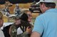 Staff Sgt. Audree Waters, an Air Force reservist assigned to the 302nd Airlift Wing’s 39th Aerial Port Squadron, hugs a family member in the Colorado Springs Airport, July 15, 2017. Waters is one of 15 39th APS reservists to return home after a six-month deployment to in Southwest Asia.  (U.S. Air Force photo/Staff Sgt. Frank Casciotta)