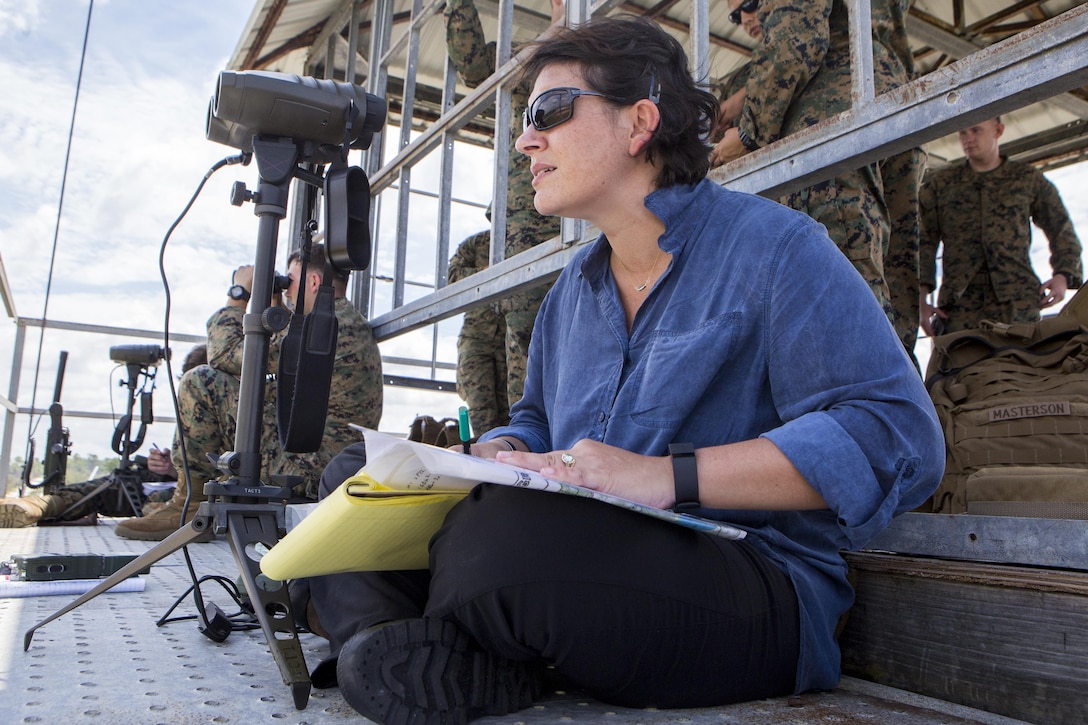 Michelle Muller, a tactical air control party program manager for Marine Forces Reserve, plots coordinates on a map during the final exercise of the Air Naval Gunfire Liaison Company primer course at Avon Park Air Force Range in Avon Park, Florida, Aug. 11, 2017.