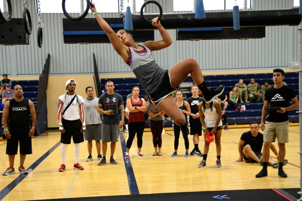 Senior Airman Jessica Ortiz-Villa, 341st Missile Security Forces Squadron member, swings before moving to the next transition ring during an Alpha Warrior competition Aug. 9, 2017, at Malmstrom Air Force Base, Mont.