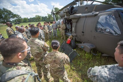 U.S. Army Reserve Soldiers from the 328th Combat Support Hospital (CSH) and 349th CSH practice hot-load litter techniques during Combat Support Training Exercise (CSTX) 86-17-02 at Fort McCoy, Wis., August 10, 2017. Hot-load litter techniques involve actual simulated casualties being carried on the litter. CSTX includes more than 12,000 service members from the Army, Navy, Air Force and Marine Corps as well as from six countries. CSTX is a large-scale training event where units experience tactical training scenarios specifically designed to replicate real-world missions. (U.S. Army Reserve photo by Spc. John Russell/Released)