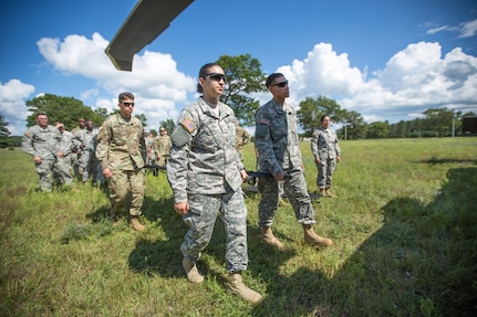 U.S. Army Reserve Soldiers from the 328th Combat Support Hospital (CSH) and 349th CSH practice hot-load litter techniques during Combat Support Training Exercise (CSTX) 86-17-02 at Fort McCoy, Wis., August 10, 2017. Hot-load litter techniques involve actual simulated casualties being carried on the litter. CSTX includes more than 12,000 service members from the Army, Navy, Air Force and Marine Corps as well as from six countries. CSTX is a large-scale training event where units experience tactical training scenarios specifically designed to replicate real-world missions. (U.S. Army Reserve photo by Spc. John Russell/Released)