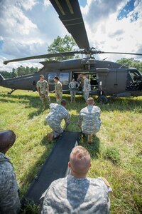 U.S. Army Reserve Soldiers from the 328th Combat Support Hospital (CSH) and 349th CSH practice hot-load litter techniques during Combat Support Training Exercise (CSTX) 86-17-02 at Fort McCoy, Wis., August 10, 2017. Hot-load litter techniques involve actual simulated casualties being carried on the litter. CSTX includes more than 12,000 service members from the Army, Navy, Air Force and Marine Corps as well as from six countries. CSTX is a large-scale training event where units experience tactical training scenarios specifically designed to replicate real-world missions. (U.S. Army Reserve photo by Spc. John Russell/Released)