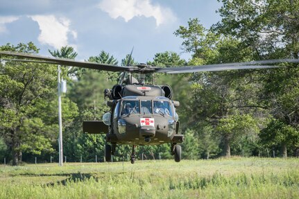 U.S. Army Reserve Soldiers from the 328th Combat Support Hospital (CSH) and 349th CSH practice hot-load litter techniques during Combat Support Training Exercise (CSTX) 86-17-02 at Fort McCoy, Wis., August 10, 2017. Hot-load litter techniques involve actual simulated casualties being carried on the litter. CSTX includes more than 12,000 service members from the Army, Navy, Air Force and Marine Corps as well as from six countries. CSTX is a large-scale training event where units experience tactical training scenarios specifically designed to replicate real-world missions. (U.S. Army Reserve photo by Spc. John Russell/Released)