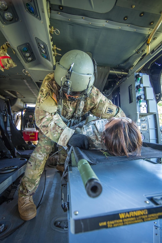 U.S. Army Reserve Soldiers from the 328th Combat Support Hospital (CSH) and 349th CSH practice hot-load litter techniques during Combat Support Training Exercise (CSTX) 86-17-02 at Fort McCoy, Wis., August 10, 2017. Hot-load litter techniques involve actual simulated casualties being carried on the litter. CSTX includes more than 12,000 service members from the Army, Navy, Air Force and Marine Corps as well as from six countries. CSTX is a large-scale training event where units experience tactical training scenarios specifically designed to replicate real-world missions. (U.S. Army Reserve photo by Spc. John Russell/Released)