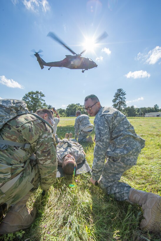 U.S. Army Reserve Soldiers from the 328th Combat Support Hospital (CSH) and 349th CSH practice hot-load litter techniques during Combat Support Training Exercise (CSTX) 86-17-02 at Fort McCoy, Wis., August 10, 2017. Hot-load litter techniques involve actual simulated casualties being carried on the litter. CSTX includes more than 12,000 service members from the Army, Navy, Air Force and Marine Corps as well as from six countries. CSTX is a large-scale training event where units experience tactical training scenarios specifically designed to replicate real-world missions. (U.S. Army Reserve photo by Spc. John Russell/Released)