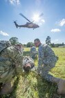 U.S. Army Reserve Soldiers from the 328th Combat Support Hospital (CSH) and 349th CSH practice hot-load litter techniques during Combat Support Training Exercise (CSTX) 86-17-02 at Fort McCoy, Wis., August 10, 2017. Hot-load litter techniques involve actual simulated casualties being carried on the litter. CSTX includes more than 12,000 service members from the Army, Navy, Air Force and Marine Corps as well as from six countries. CSTX is a large-scale training event where units experience tactical training scenarios specifically designed to replicate real-world missions. (U.S. Army Reserve photo by Spc. John Russell/Released)
