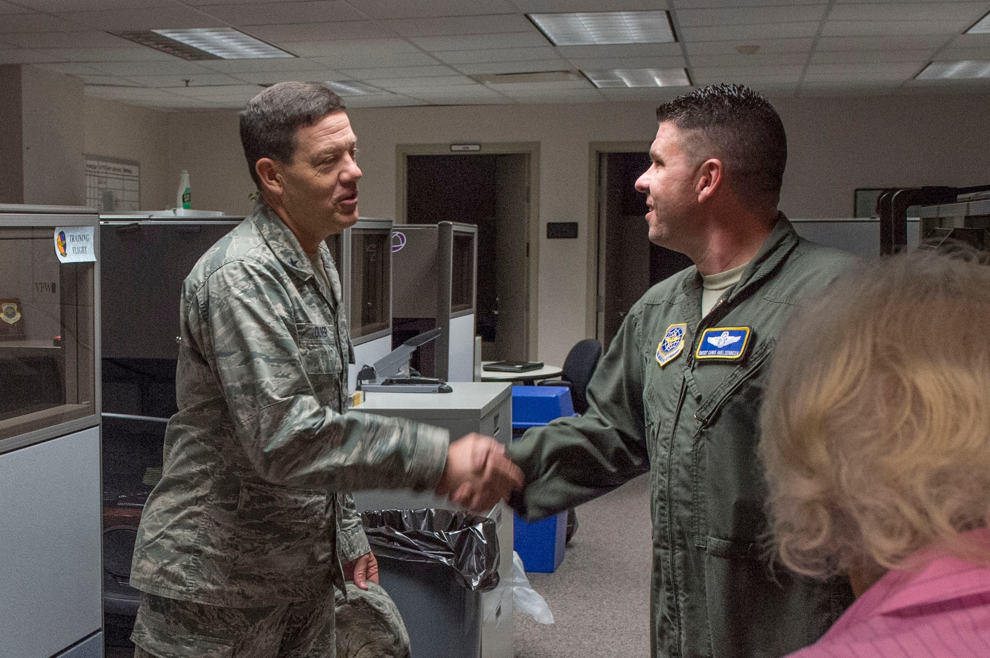 Brig. Gen. Stephen W. Oliver, U.S. Air Force Expeditionary Center vice commander, shakes the hand of Senior Master Sgt. Christopher Huelsenbeck, 621st Air Mobility Operations Squadron superintendent, during a tour of the 621st AMOS during their participation in Exercise Mobility Guardian at Joint Base McGuire-Dix-Lakehurst, N.J., August 1, 2017. The Expeditionary Center is the Air Force's Center of Excellence for advanced combat support training and education, while also providing direct oversight for en route and installation support, contingency response, and building partner capacity mission sets within the global mobility enterprise. (U.S. Air Force photo by Tech. Sgt. Gustavo Gonzalez/RELEASED)