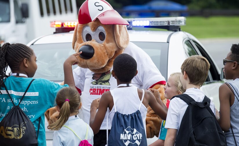 Children interact with Scruffy.