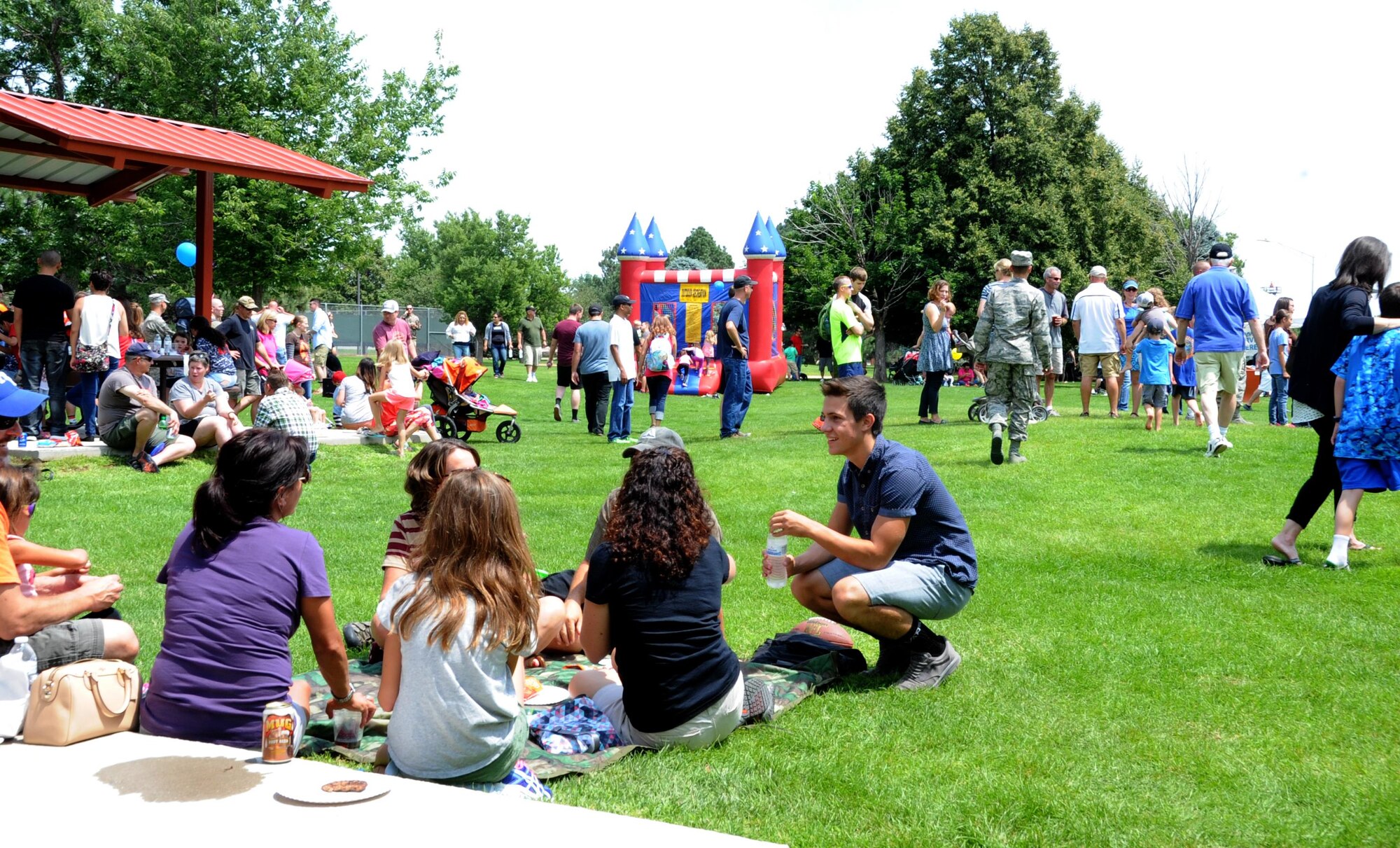 Members of the 302nd Airlift Wing and their families gather at the David Lyon Memorial Park during the Reserve wing’s annual Family Day event at Peterson Air Force Base, Colo., Aug. 5, 2017.