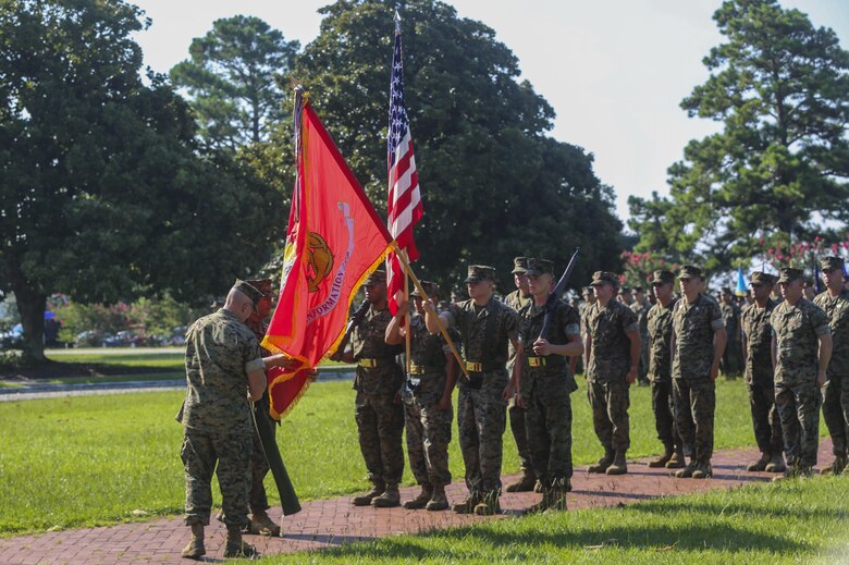 Col. David Owen and Sgt. Maj. Rene Salinas unveil the new unit colors for II Marine Expeditionary Force Information Group during a redesignation ceremony, during which II Marine Expeditionary Force Headquarters Group was renamed II MEF Information Group at Camp Lejeune, N.C., July 21, 2017. The unit’s redesignation to II MIG is the first visible action complimentary to the forthcoming capabilities that support the Commandant’s priorities to modernize the force and develop increased capability in the information environment. Owen is the Commanding Officer and Salinas is the Sergeant Major of II MIG.