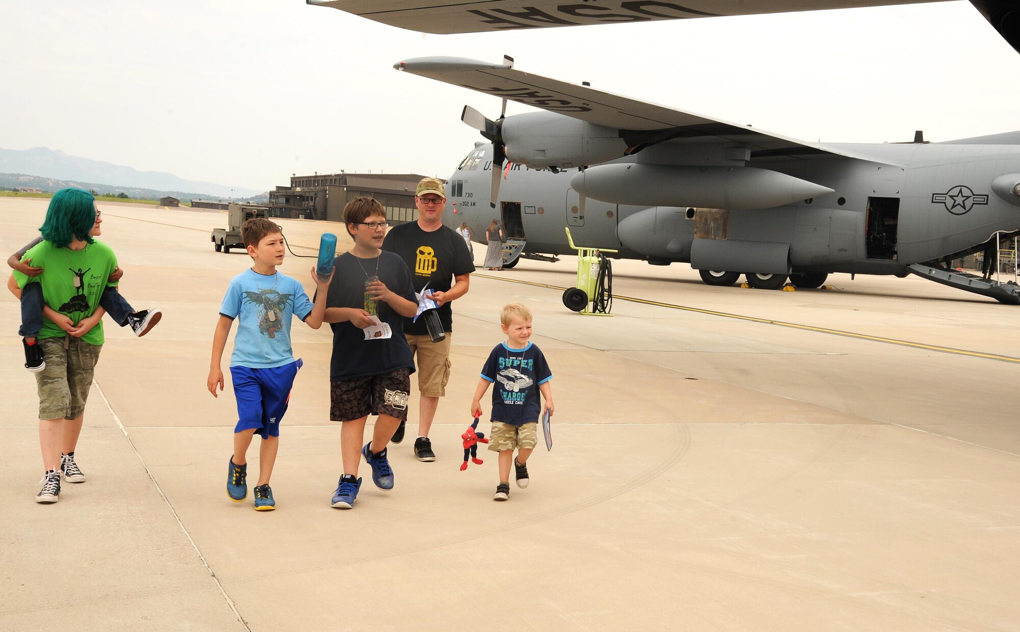 Tech. Sgt. Jeremiah Harden, 302nd Maintenance Squadron, and his family take part in the 302nd Airlift Wing Family Day Herc Adventure Tour and unit displays, Aug. 5, 2017, Peterson Air Force Base, Colo.