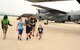 Tech. Sgt. Jeremiah Harden, 302nd Maintenance Squadron, and his family take part in the 302nd Airlift Wing Family Day Herc Adventure Tour and unit displays, Aug. 5, 2017, Peterson Air Force Base, Colo. The Herc Adventure Tour offered family and friends of Reserve Citizen Airmen the opportunity to learn about the wing’s aeromedical evacuation mission, the survival gear flight crews use and C-130 Hercules aircraft capabilities. (U.S. Air Force photo/Staff Sgt. Amber Sorsek)