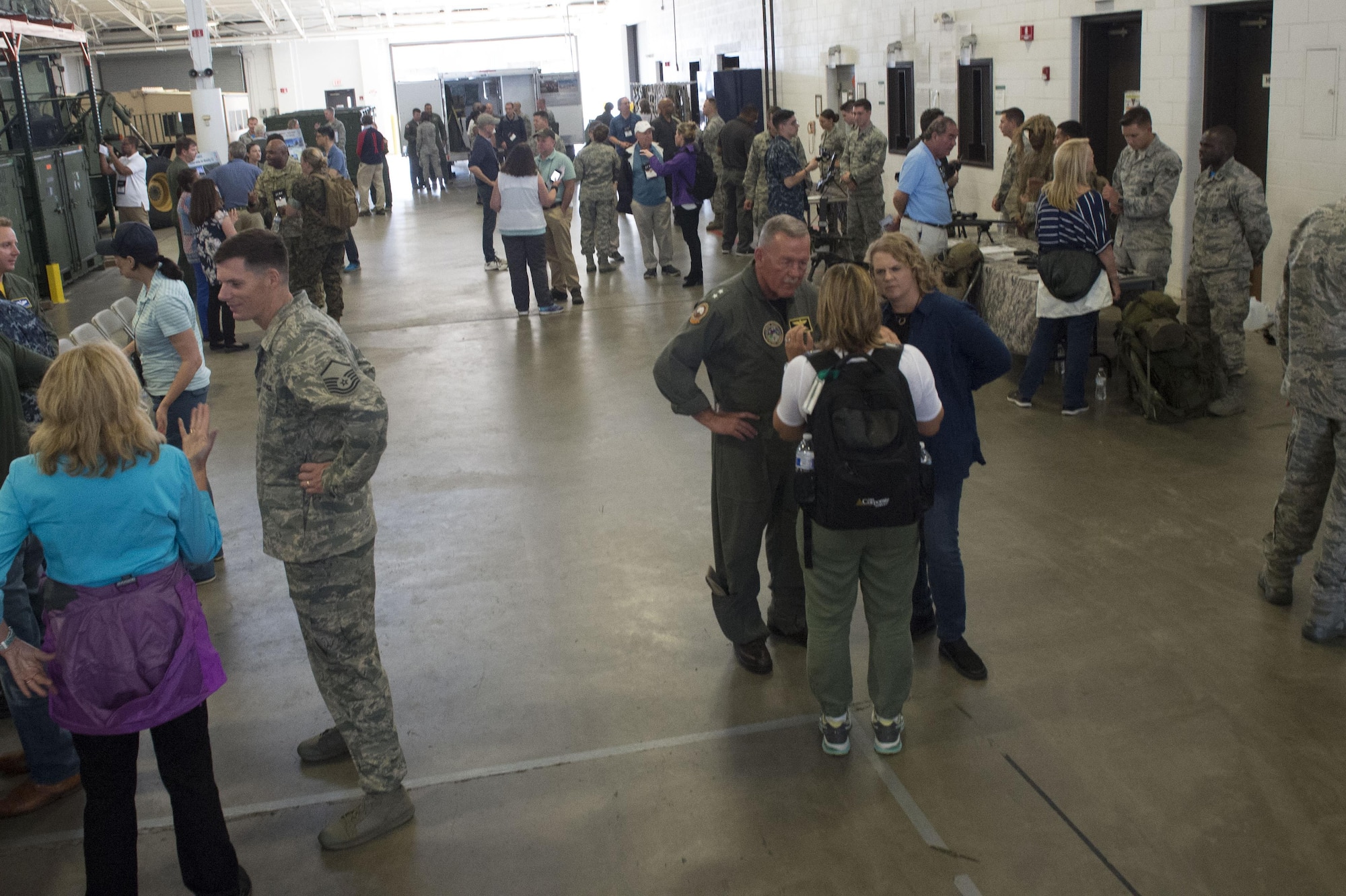 Joint Civilian Orientation Course participants interact with members of the 621st Contingency Response Wing during a tour of the 621st CRW at Joint Base McGuire-Dix-Lakehurst, N.J., August 11, 2017. Approximately 50 participants attended the event. (U.S. Air Force photo by Tech. Sgt. Gustavo Gonzalez/RELEASED)