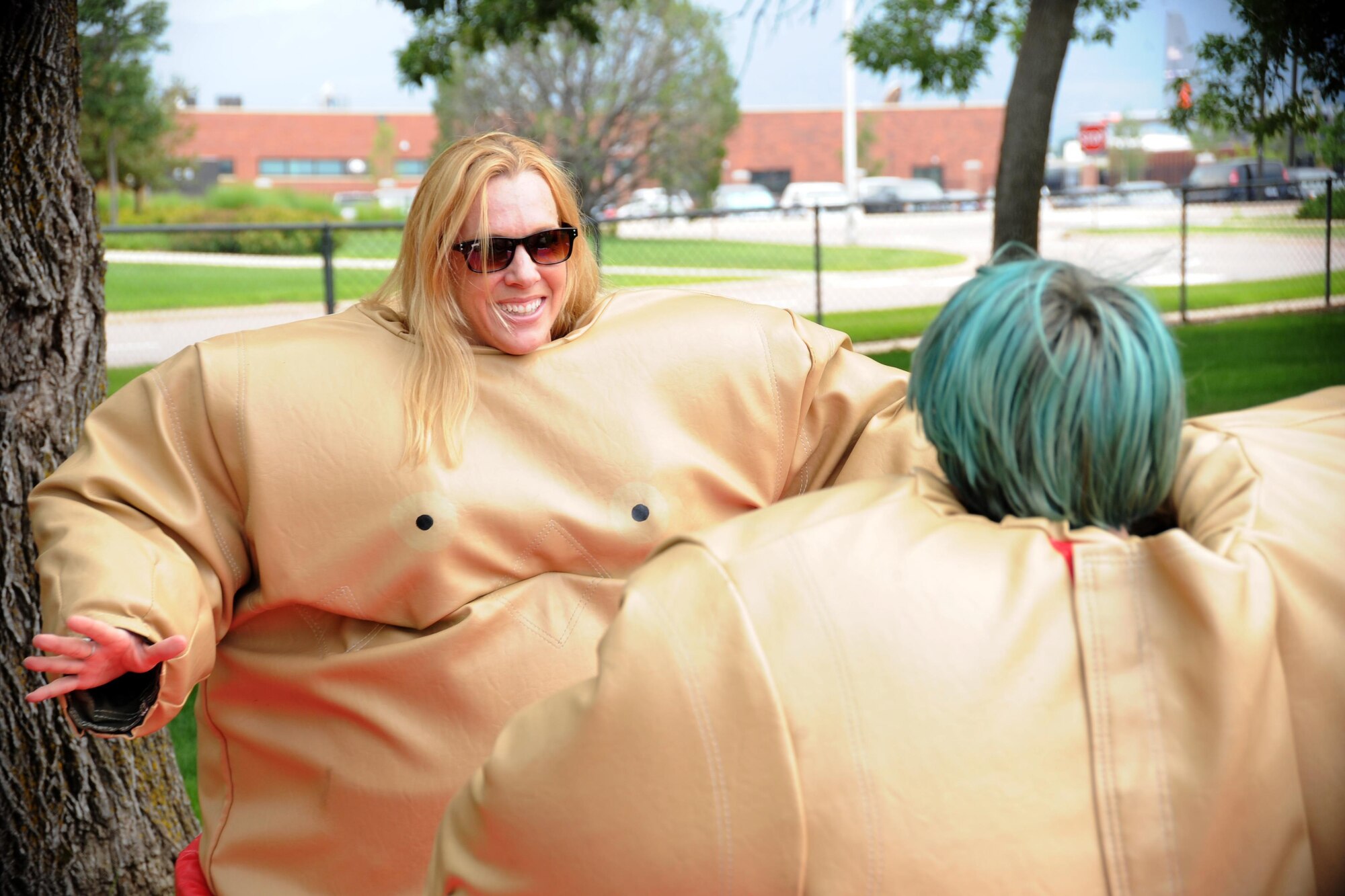 Tech. Sgt. Denise Flory, the 302nd Airlift Wing historian, and her son prepare to wrestle wearing oversized sumo suits at the David Lyon Memorial Park during the Reserve wing’s annual Family Day event at Peterson Air Force Base, Colo., Aug. 5, 2017.