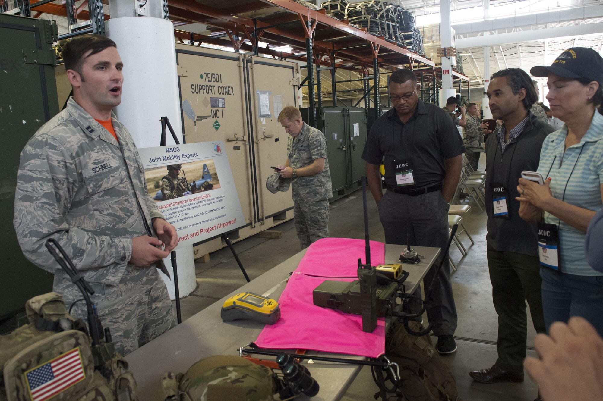 Capt. Andrew Schnell, 321st Contingency Response Squadron officer, speaks to participants of the Joint Civilian Orientation Course during a tour of the 621st Contingency Response Wing at Joint Base McGuire-Dix-Lakehurst, N.J., August 11, 2017. The JCOC is the oldest and most prestigious public liaison program in the Department of Defense, and is the only outreach program sponsored by the Secretary of Defense. (U.S. Air Force photo by Tech. Sgt. Gustavo Gonzalez/RELEASED)