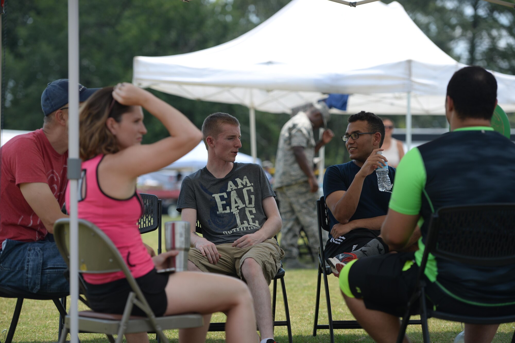 A group Airmen gather at the End of Summer Aug. 4, 2017, on Columbus Air Force Base, Mississippi. A large group of base members gathered at the End of Summer Bash to socialize, play games and have fun. (U.S. Air Force photo by Airman 1st Class Keith Holcomb)