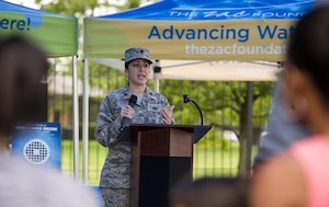 Maj. Jennifer Stewart, 11th Force Support Squadron operations officer, speaks to swim safety camp attendees.