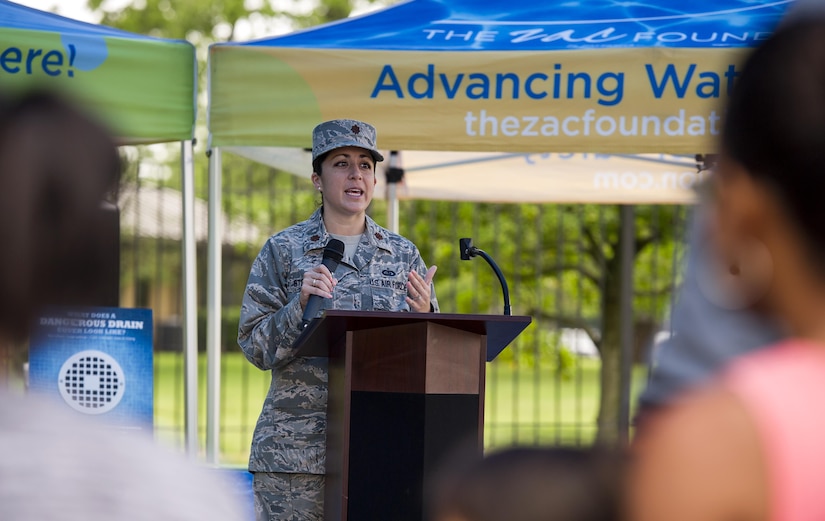 Maj. Jennifer Stewart, 11th Force Support Squadron operations officer, speaks to swim safety camp attendees.