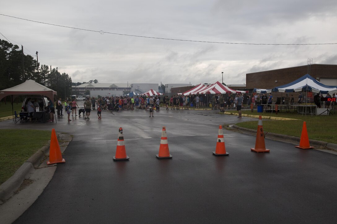 Participants gather for the Run to Remember memorial run at Camp Lejeune, N.C., Aug 5, 2017. The run is held every first Saturday of August in honor of Sgt. Lucas Pyeatt, a cryptologic linguist killed in action during Operation Enduring Freedom, February 2011, and other service members killed in action.
