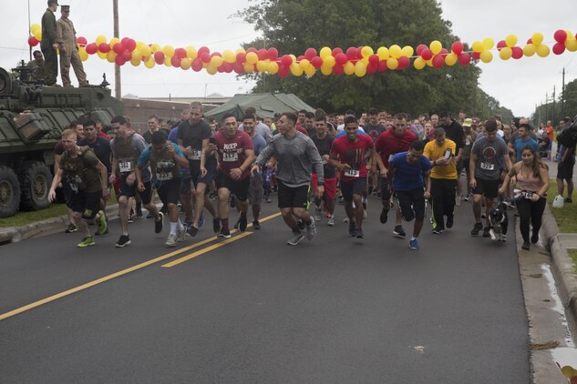 Participants take off from the starting line during the Run to Remember memorial run at Camp Lejeune, N.C. Aug 5, 2017. The run is held every first Saturday of August in honor of Sgt. Lucas Pyeatt, a cryptologic linguist killed in action during Operation Enduring Freedom, February 2011, and other service members killed in action.
