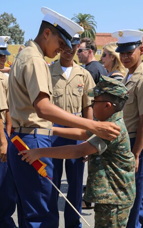 Marines from Golf Company, 2nd Recruit Training Battalion, march as a company for the last time on graduation day at Marine Corps Recruit Depot San Diego, today.