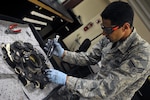 Senior Airman Adam Amosa, 56th Component Maintenance Squadron hydraulics journeyman, disassembles an A-10 Thunderbolt landing gear brake at Luke Air Force Base, Ariz. August 8, 2017. The break pad was disassembled to inspect and determine if the piece was serviceable.  (U.S. Air Force photo/Airman 1st Class Pedro Mota)
